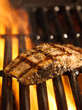 salmon fillet on the grill with flames