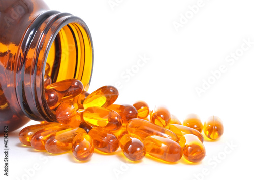 Photo: Fish oil bottle and capsules Fish oil bottle and capsules