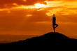 Silhouette of a beautiful Yoga woman in the morning