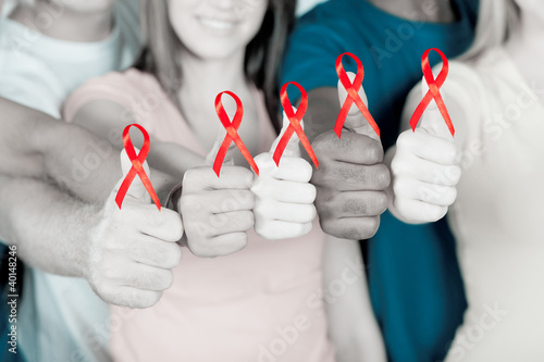 Photo: young multiracial people supporting AIDS HIV prevention young multiracial people supporting AIDS HIV prevention