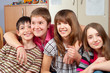 Happy teenage friends spending time together and having fun