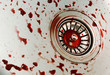 a lot of fake blood drops in metal kitchen sink
