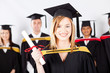 group of multiracial graduates at graduation