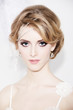 Portrait of young beautiful bride over white background