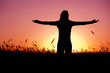 Woman relaxing at sunset Woman relaxing at sunset