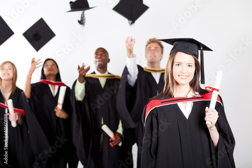 Photo: university graduate at graduation with classmates university graduate at graduation with classmates