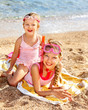 Children Playing On  Beach.