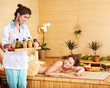 Young woman getting massage in spa. Young woman getting massage in spa.