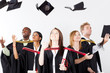 graduates throwing caps at graduation