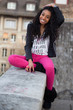 Portrait of a happy young african american teenage girl listenin