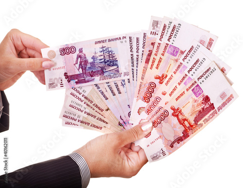 Photo: Female hand with money (Russian rouble). Female hand with money (Russian rouble).