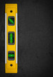 Bubble level on a textured black background