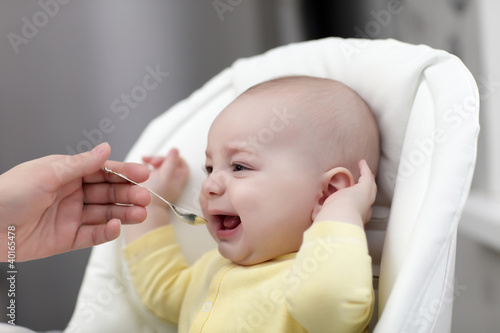 Photo: crying baby with food crying baby with food