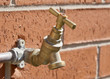 Outside tap on brick wall