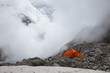 Orange tent in a high mountains