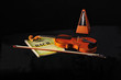 Violin, Bach score and metronome on black Violin, Bach score and metronome on black