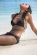 Sexy pretty young girl lying on the beach (Maldives / Malediven)