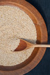 Wooden spoon and quinoa grains