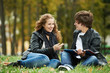 Two smiling young students outdoors