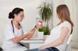 Photo: Pregnant woman and doctor. Pregnant woman and doctor.