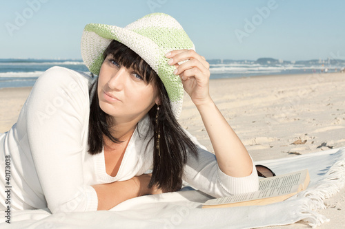 Photo: attractive woman relax on the beach attractive woman relax on the beach