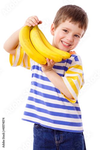 Photo: Happy boy holds a bunch of bananas Happy boy holds a bunch of bananas
