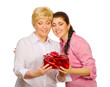Daughter giving gift to her mother