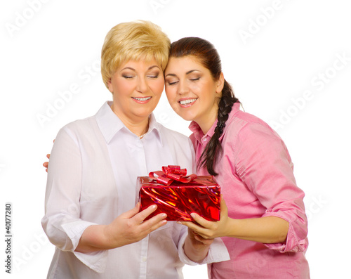 Photo: Daughter giving gift to her mother Daughter giving gift to her mother