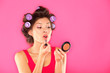 Makeup woman putting lipstick Makeup woman putting lipstick