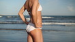 Video: Sexy woman body in white bikini posing by the sea Sexy woman body in white bikini posing by the sea