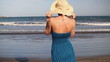 Video: Woman in blue dress standing by the sea, slow motion Woman in blue dress standing by the sea, slow motion