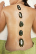 Woman at Health Spa Hot Stone Treatment Massage
