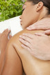Woman Relaxing At Health Spa Having Massage Treatment