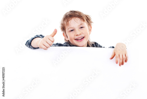 Foto: Boy holding a banner isolated on white background Boy holding a banner isolated on white background