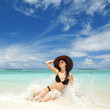 Happy fashion woman on the beach