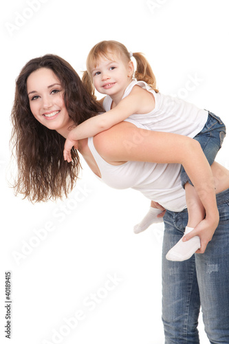 Foto: Happy mother and daughter playing on the white background Happy mother and daughter playing on the white background