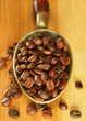 Coffee beans in metal scoop Coffee beans in metal scoop