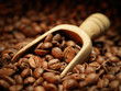 Coffee beans and wooden scoop Coffee beans and wooden scoop