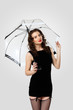 Woman dressed in retro style with umbrella Woman dressed in retro style with umbrella