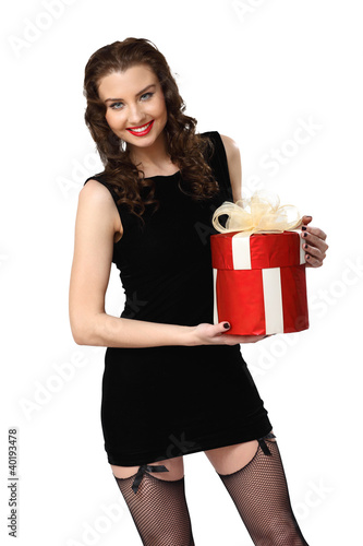 Foto: Woman in black dress with a gift box Woman in black dress with a gift box