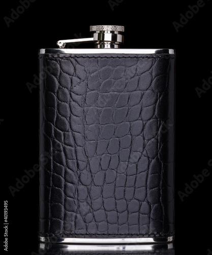 Photo: Hip flask isolated on black with reflection Hip flask isolated on black with reflection