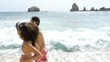 Couple running by the seashore