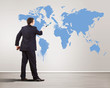 Businessman with paint brush and world map Businessman with paint brush and world map