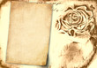 vintage background with old paper and rose bud vintage background with old paper and rose bud