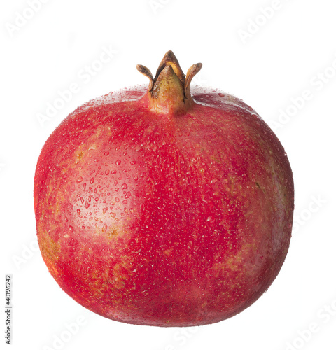 Photo: isolated fruit on white,a pomegranate with drops isolated fruit on white,a pomegranate with drops