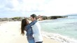 In love couple walking by the beach
