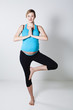 Pregnant woman doing yoga exercise