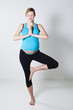 Pregnant woman doing yoga exercise