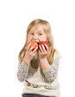 little girl eats two apples at once little girl eats two apples at once