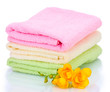 colorful towels and flowers isolated on white